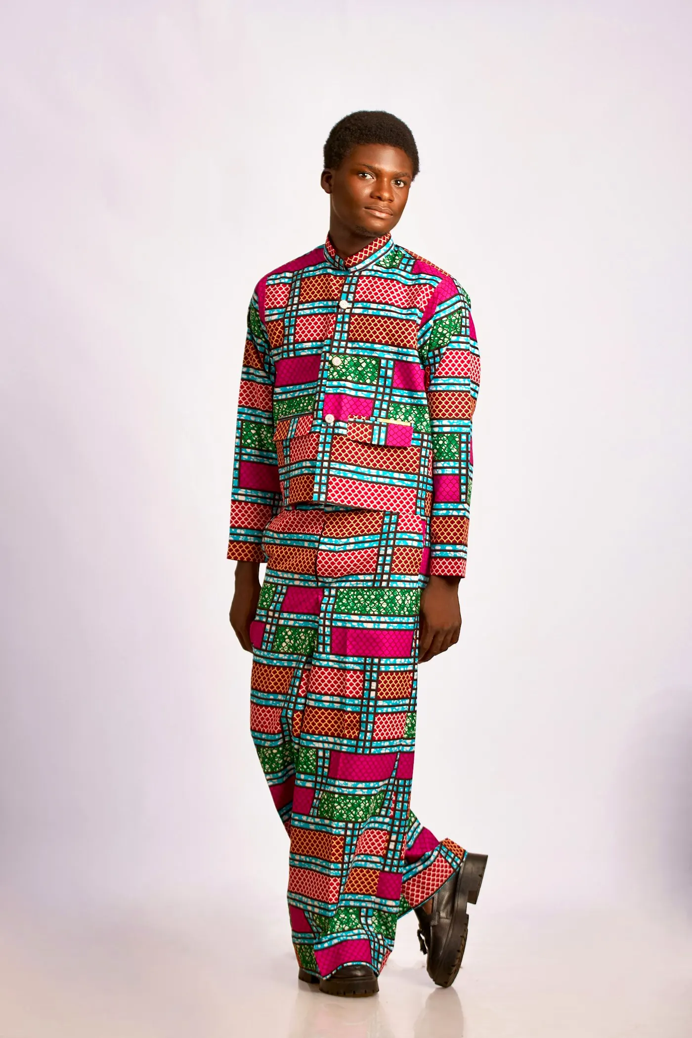Man in a matching geometric-print jacket and trousers.